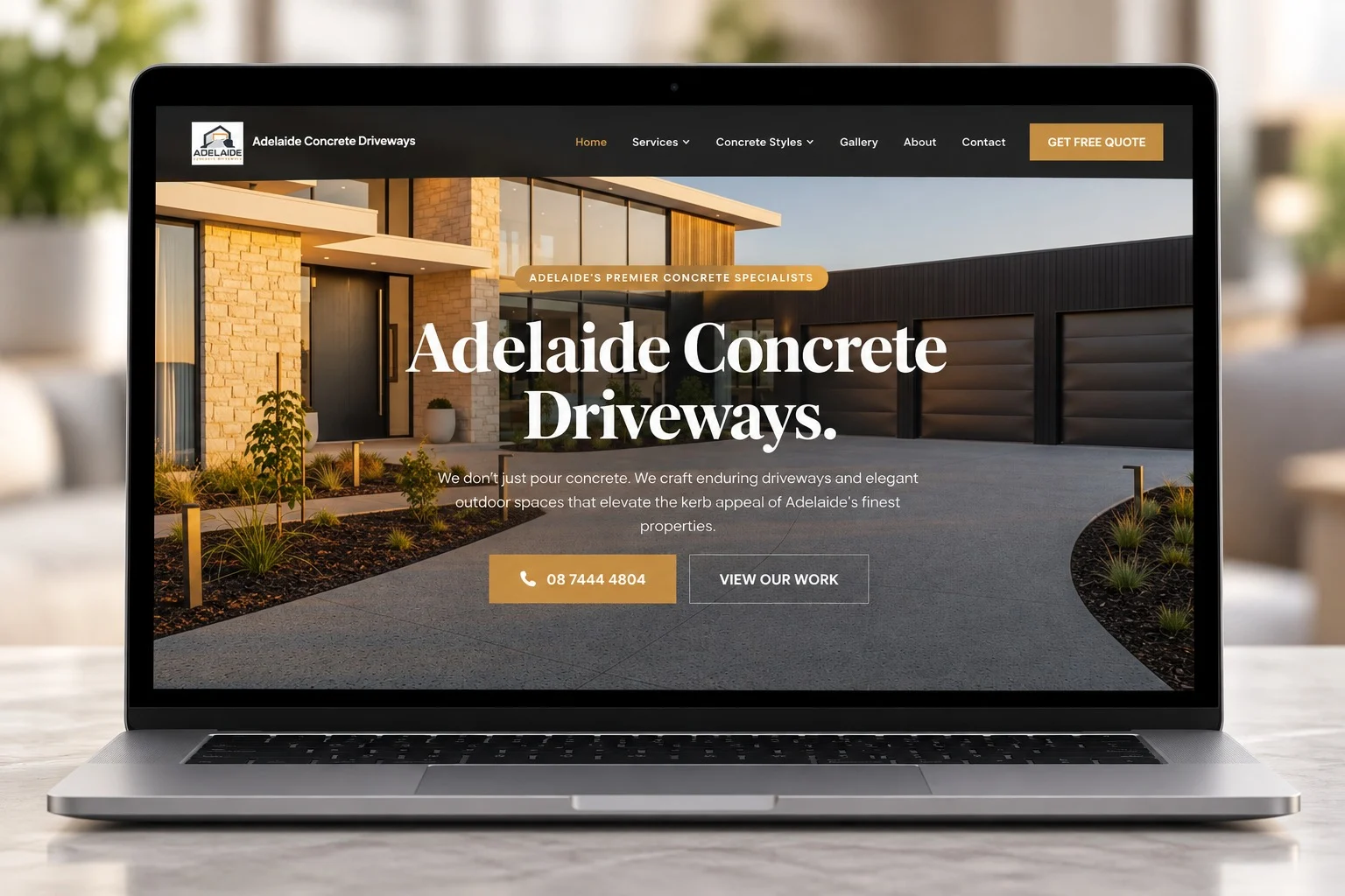 New Adelaide Concrete Driveways website homepage shown on a laptop
